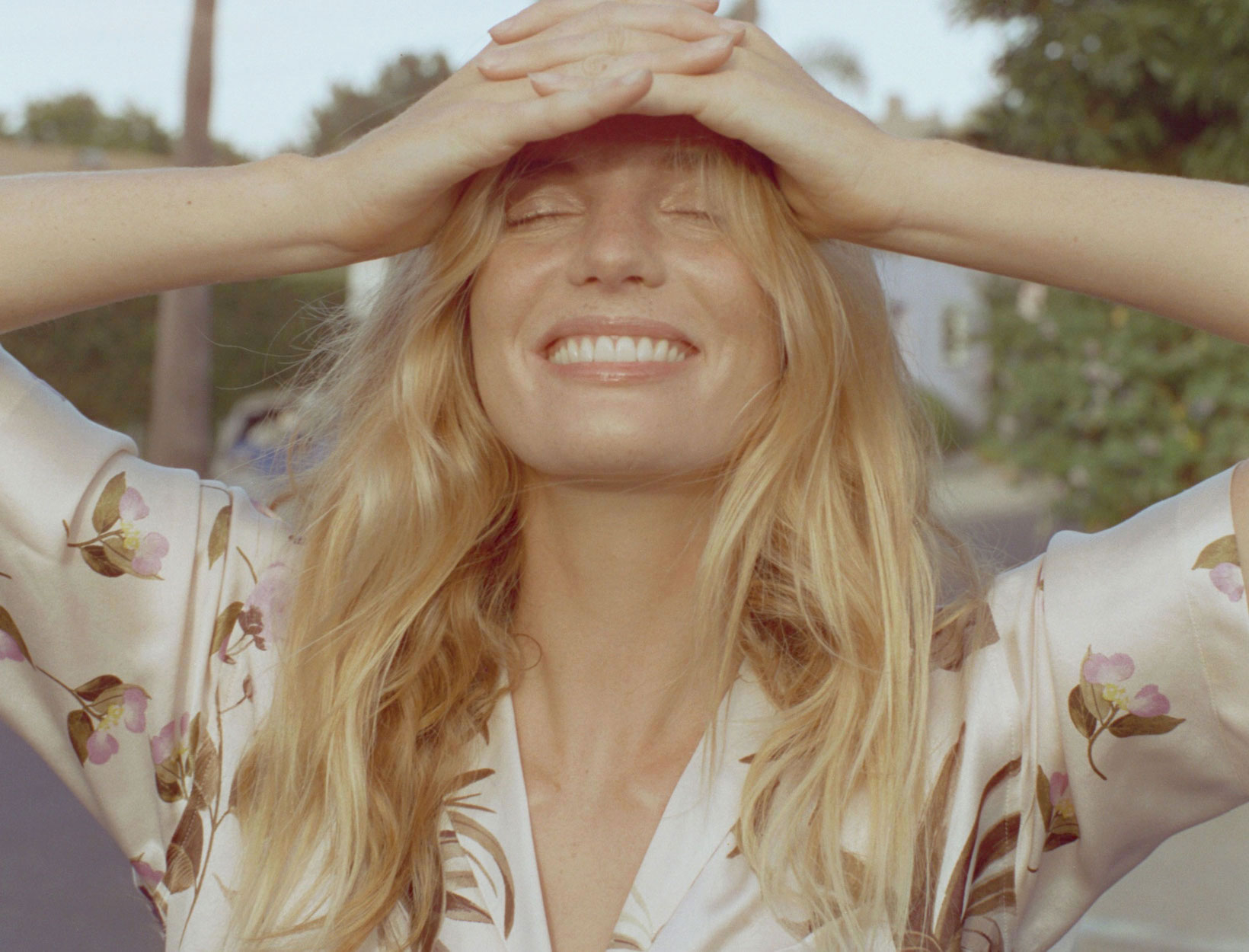 woman shielding her look   from the sun