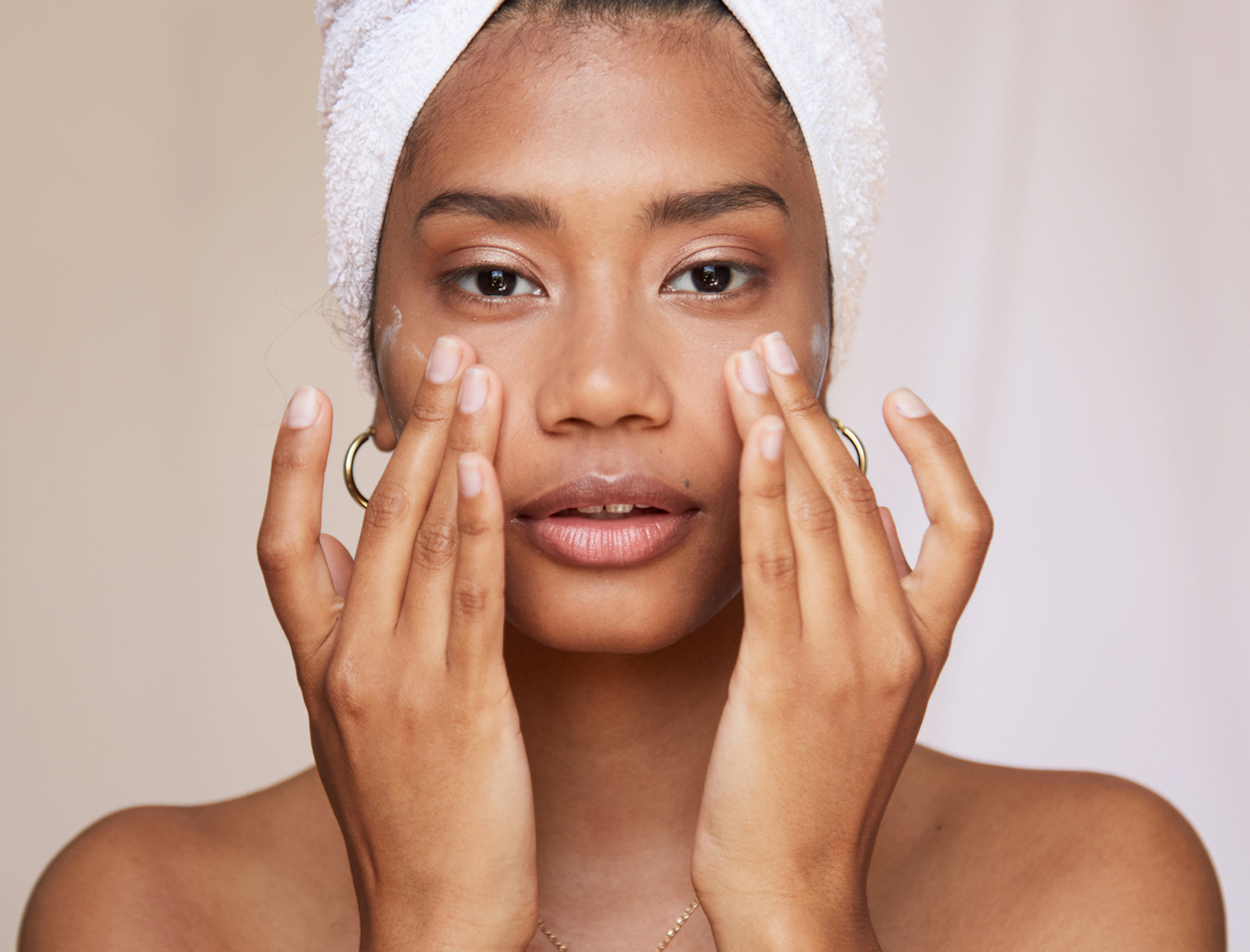 woman washing her face