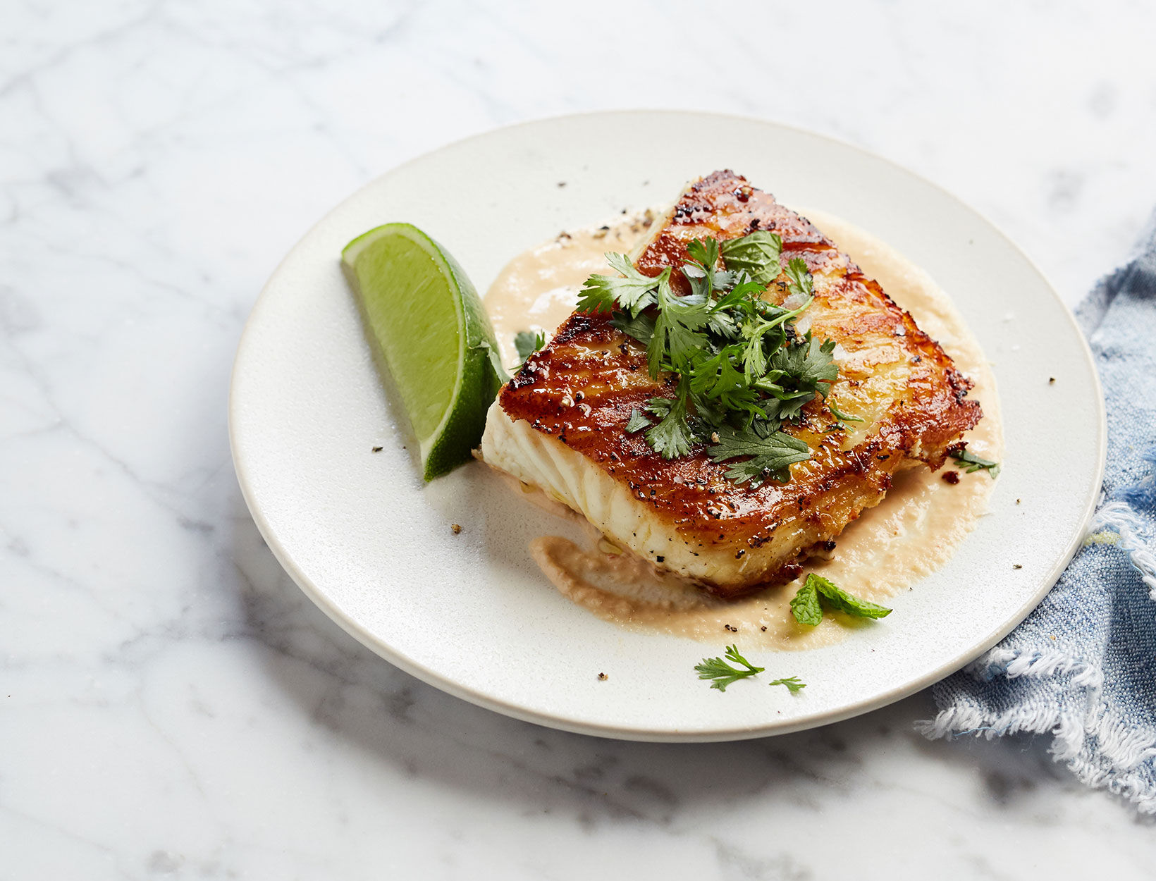 Pan-Seared Halibut with Peanut Drizzle and Herbs