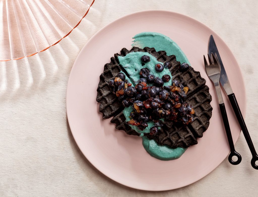 Charcoal Oat Waffles with Blueberries and Spirulina Yogurt Recipe goop image