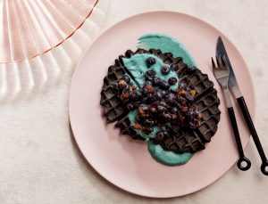 Charcoal Oat Waffles with Blueberries and Spirulina Yogurt