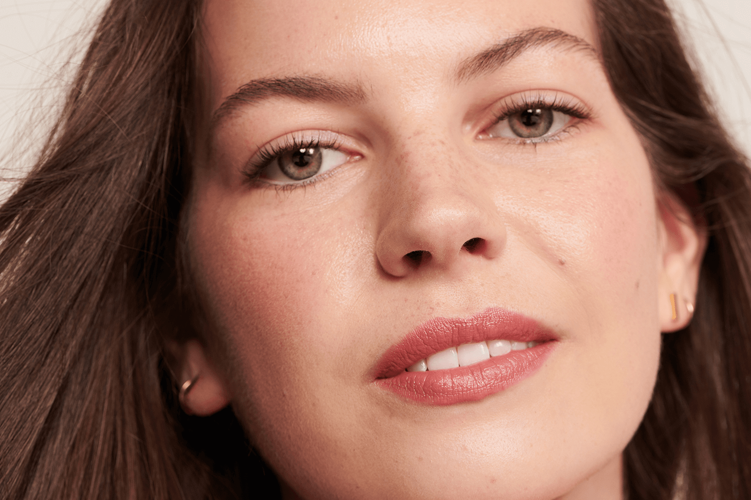 Model wearing pink lipstick