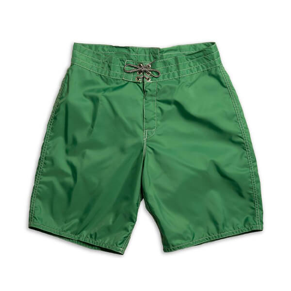 Green men's boardhshorts with white stitching