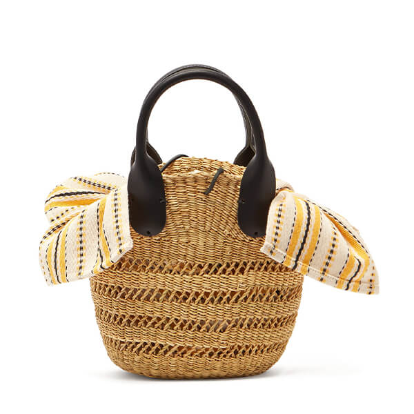 Straw bag with black handles printed fabric attached