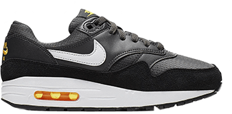 Black and white nike sneakers with a little yellow detailing 