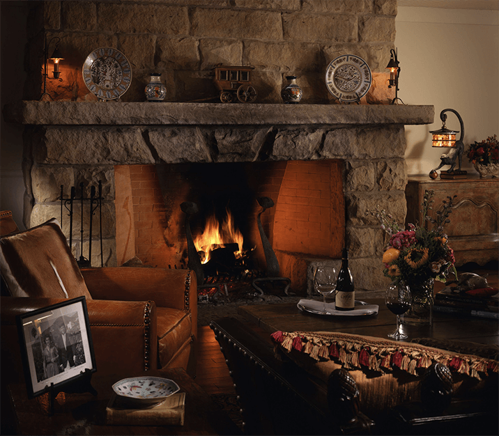 leather armchair by fire