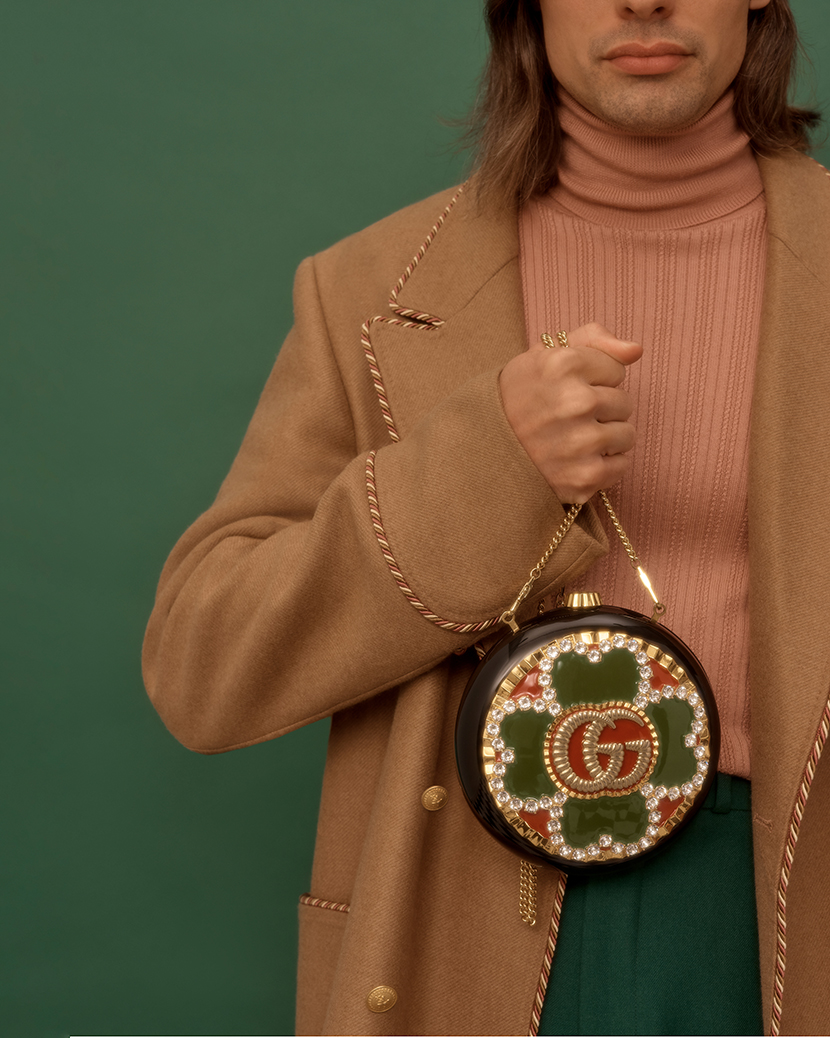 Model holding Gucci bag