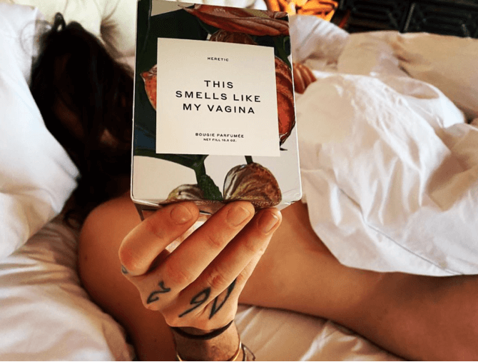 woman in bed with vagina candle