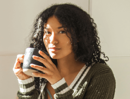 woman drinking from mug