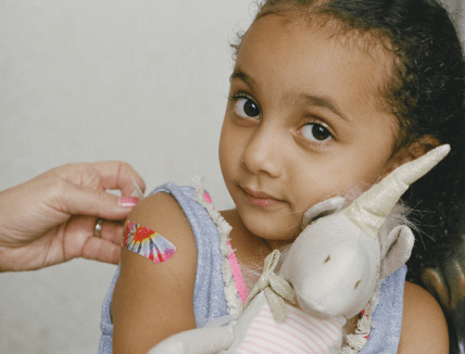 young girl with bandaid
