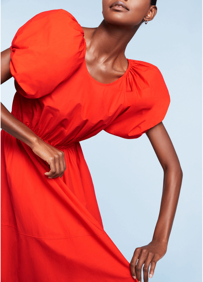 model wearing orange dress