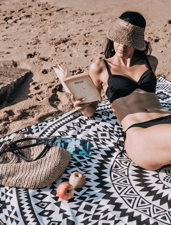 Model reading on the beach