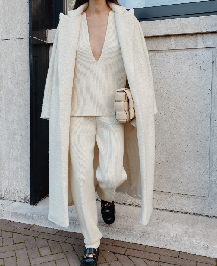 model in white tailored coat