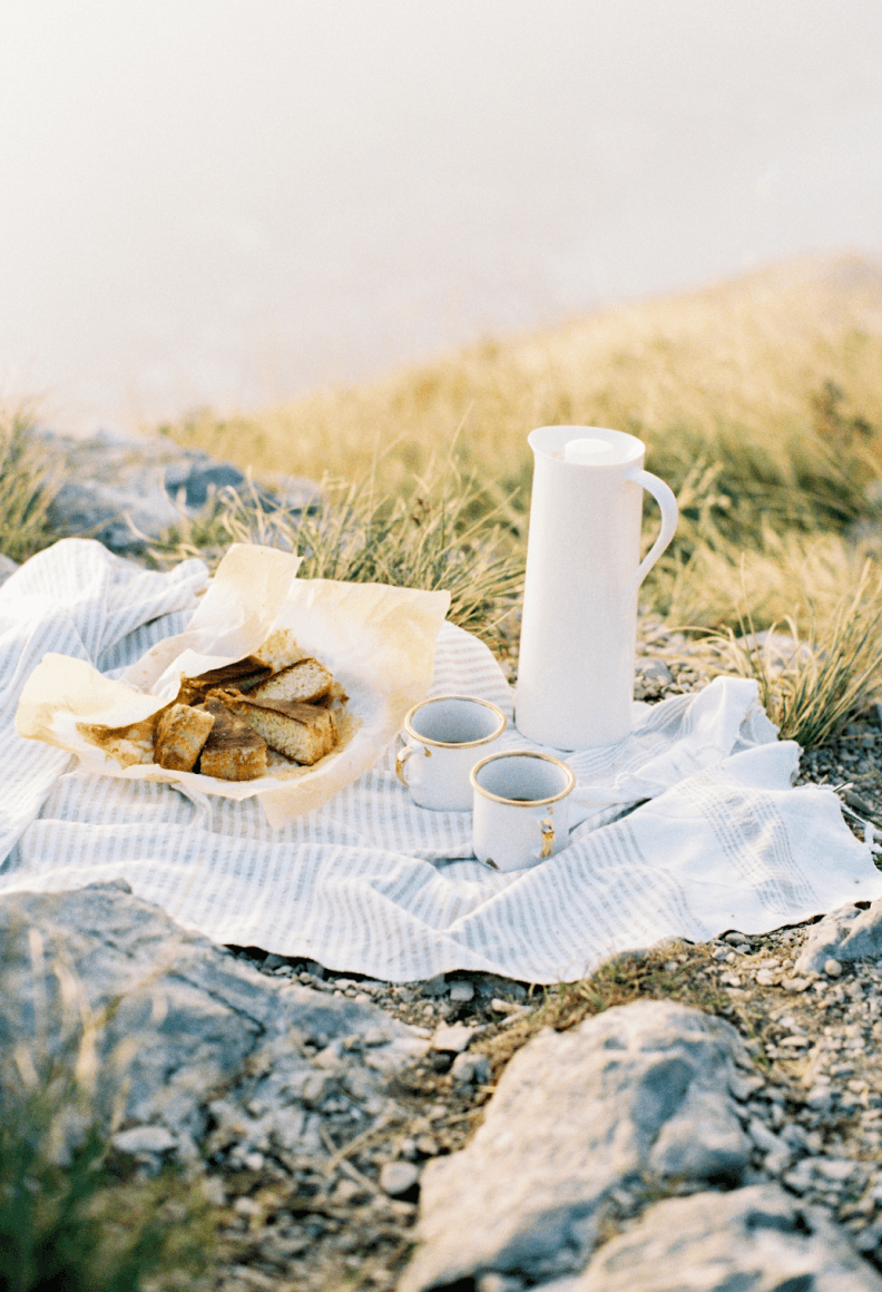 tea and cake on a picnic blanket