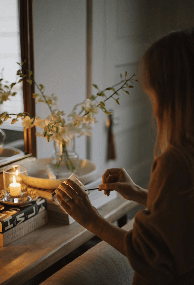 woman lighting candles