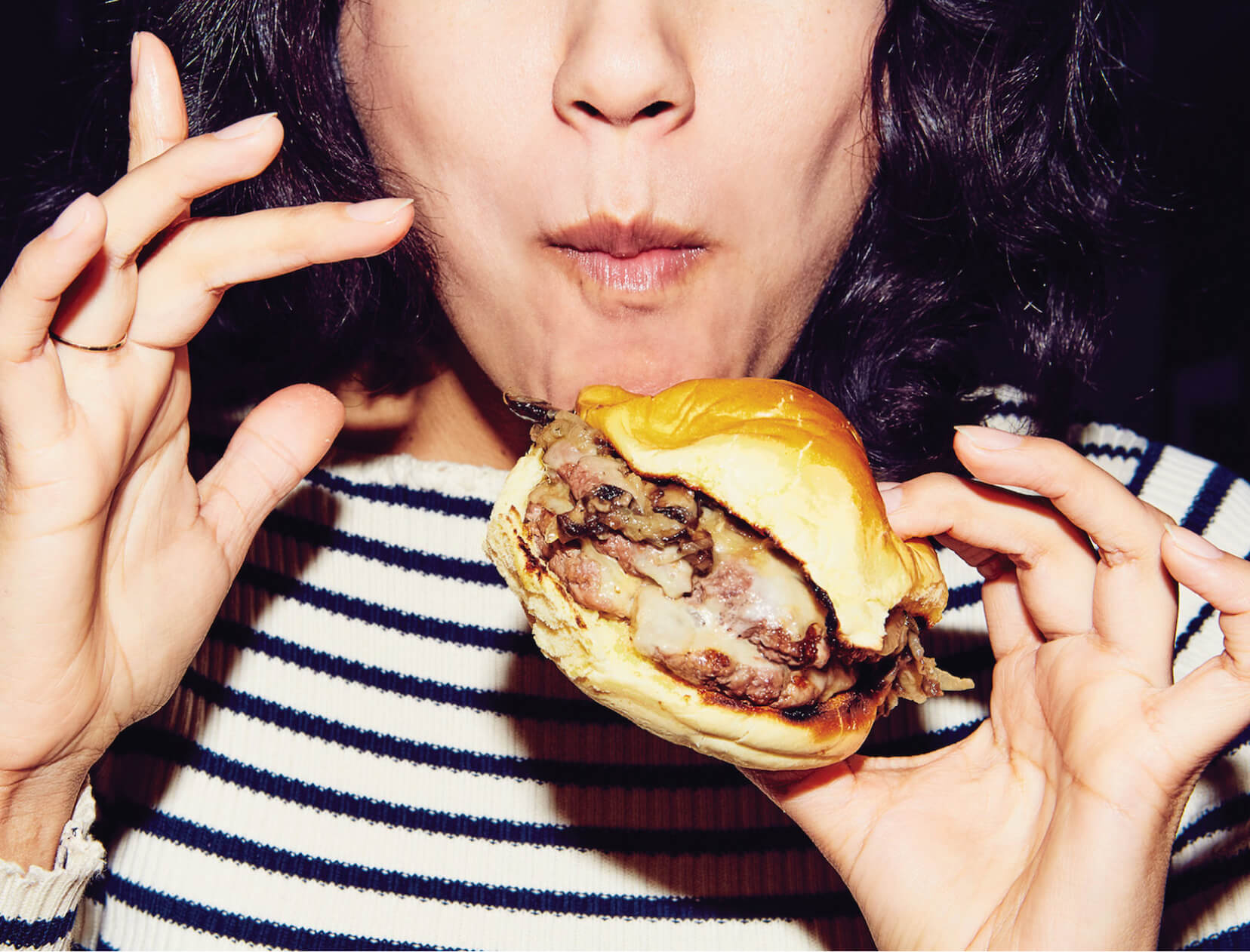 woman eating burger