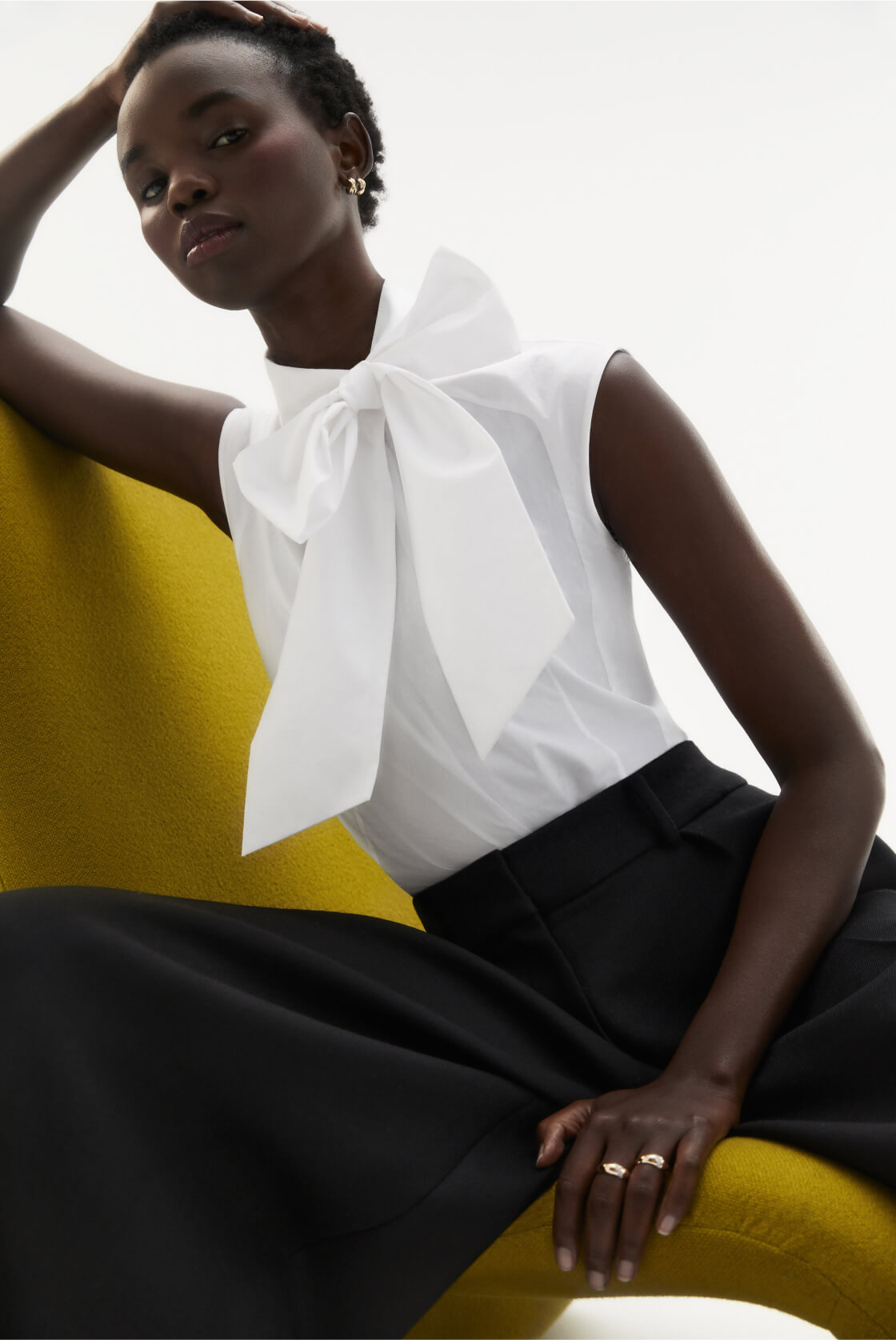 woman posing wearing g label