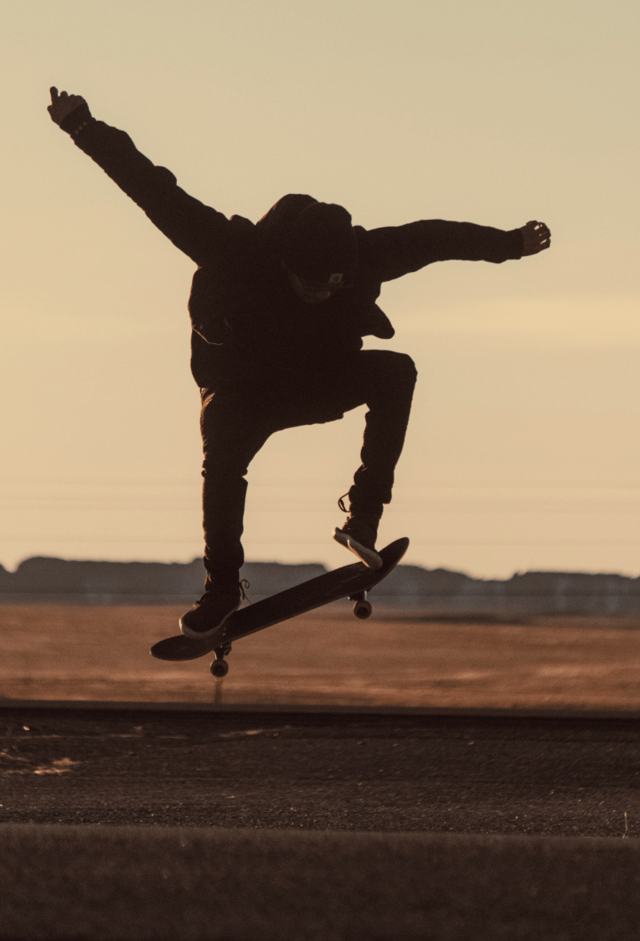 person doing an ollie on a skateboard