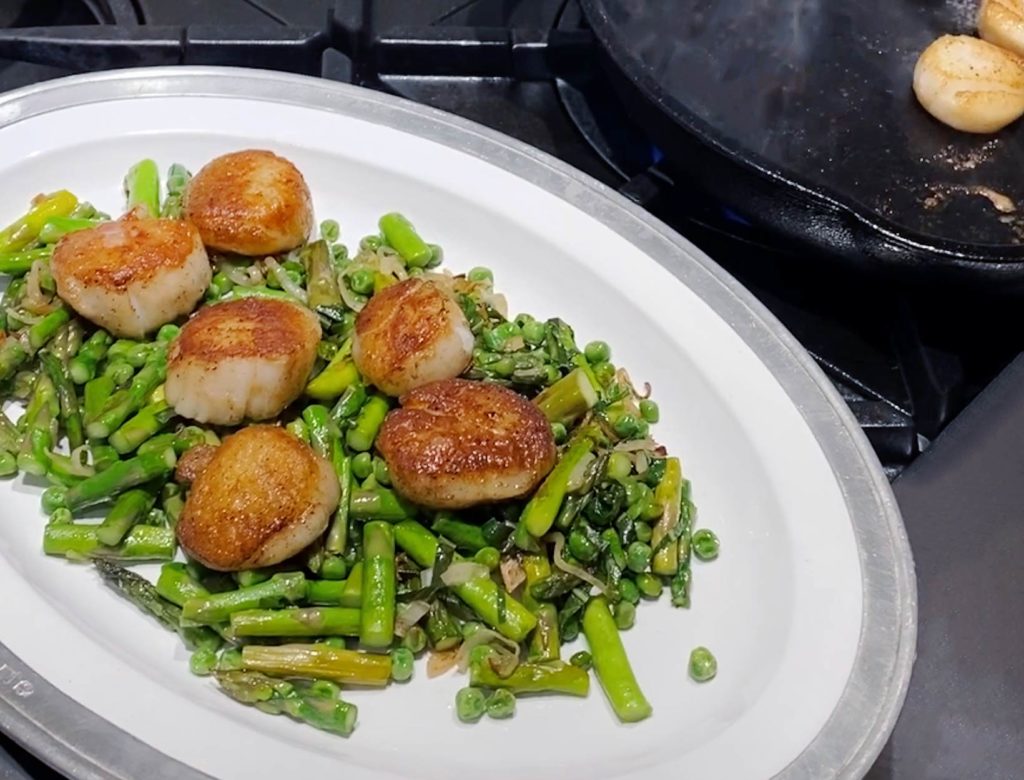 Seared Sea Scallops over Sautéed Asparagus and Peas