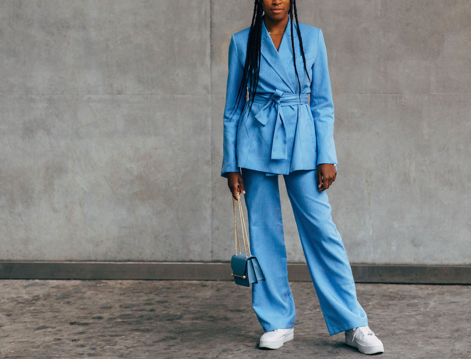 woman in a matching blue blazer and pants