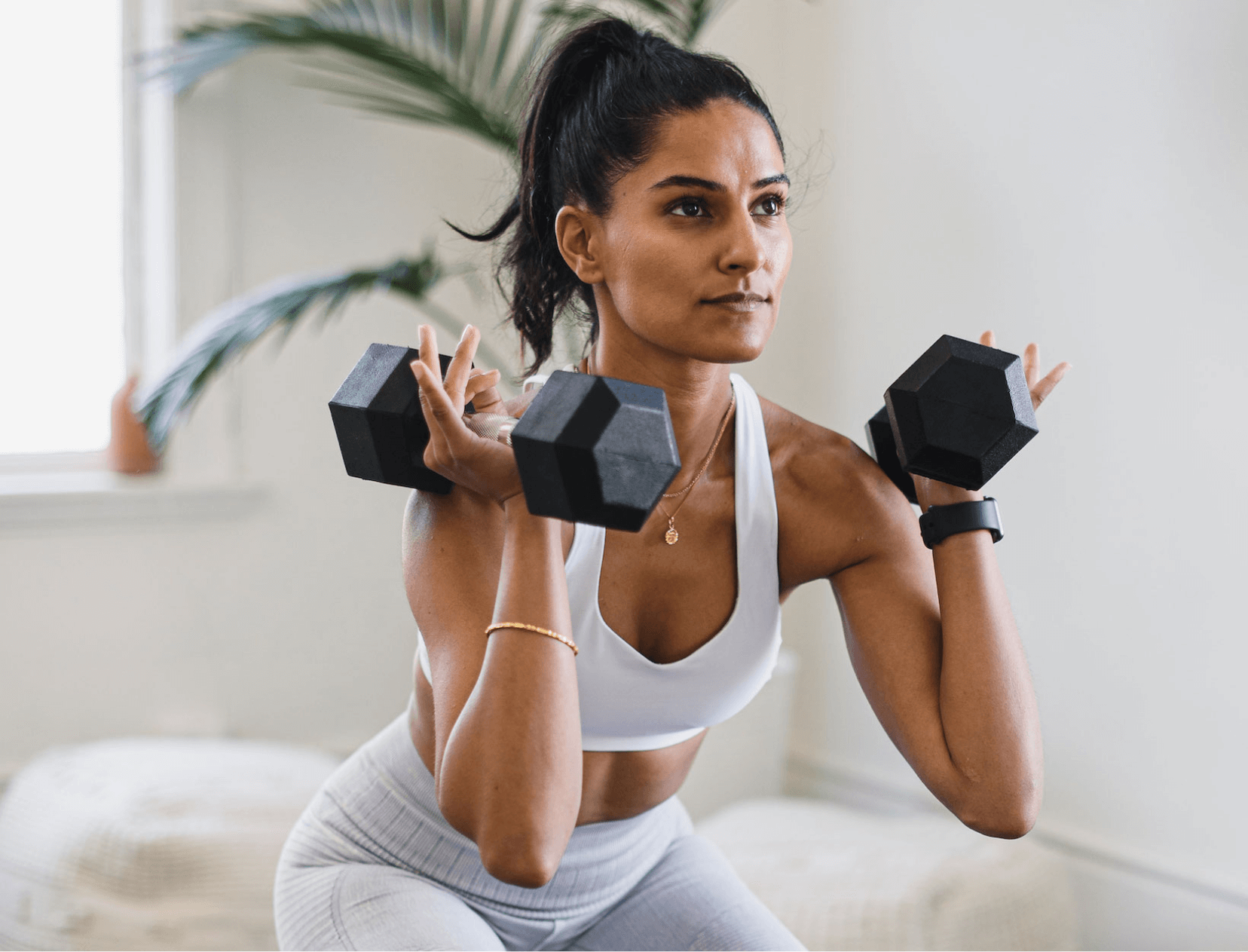 a woman who works with dumbbells