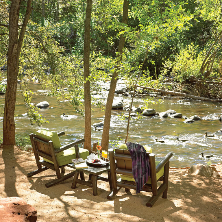 chairs by a stream