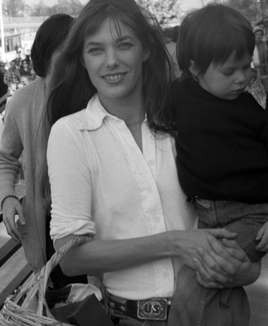 woman in white top and jeans