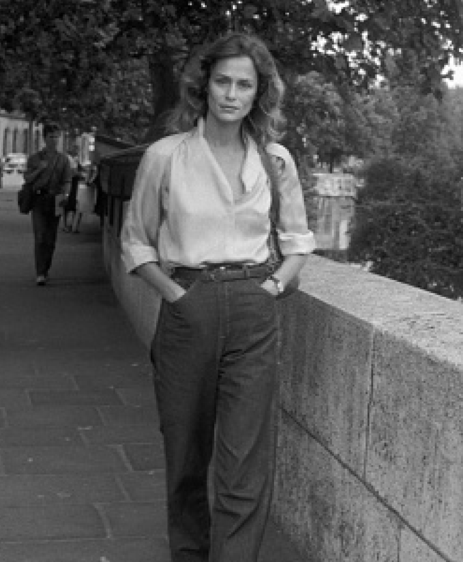 a woman in a white top and jacket