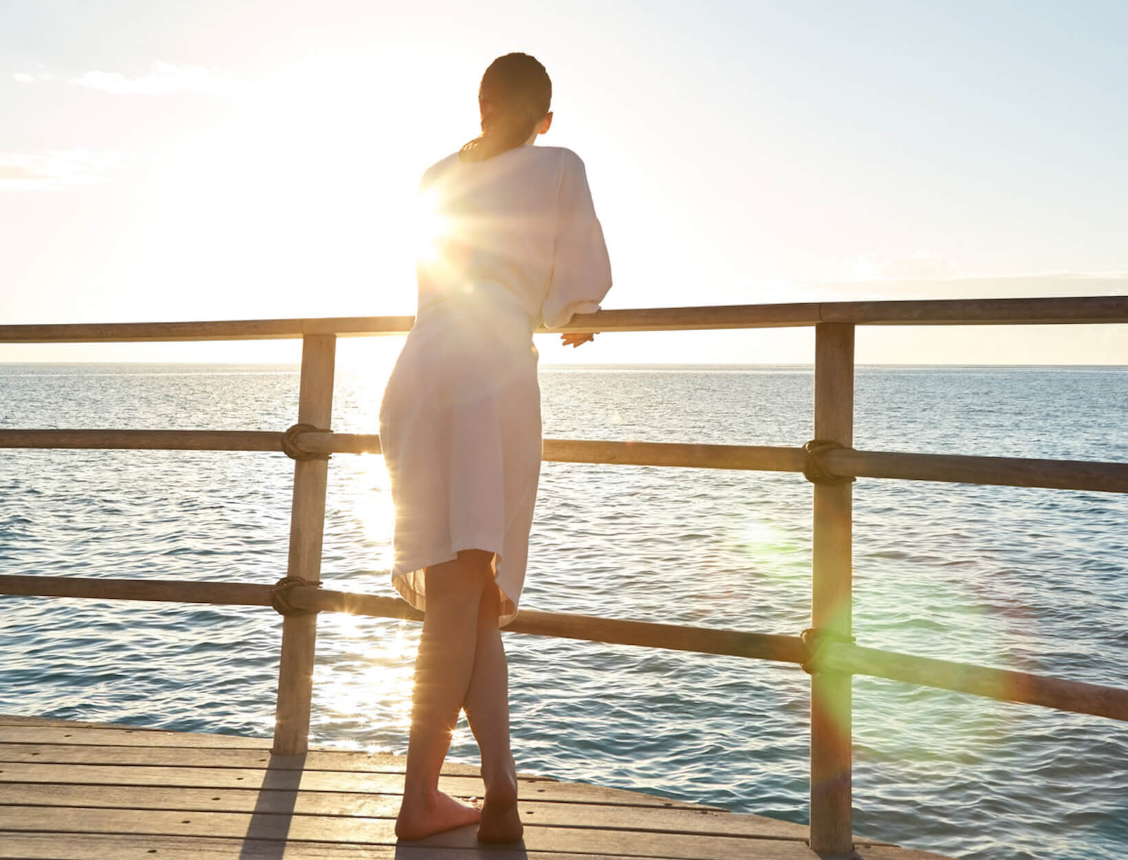 woman looking astatine  the ocean