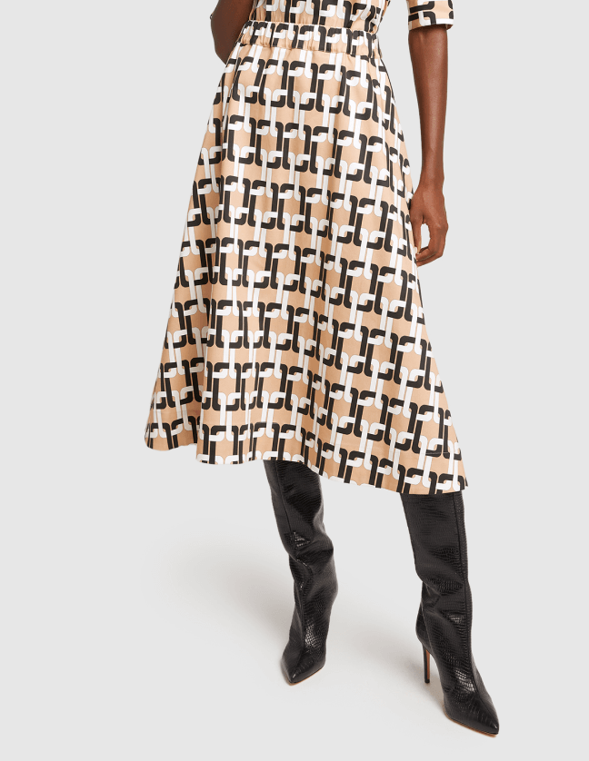 Model wears G-label Evie medium-length printed skirt