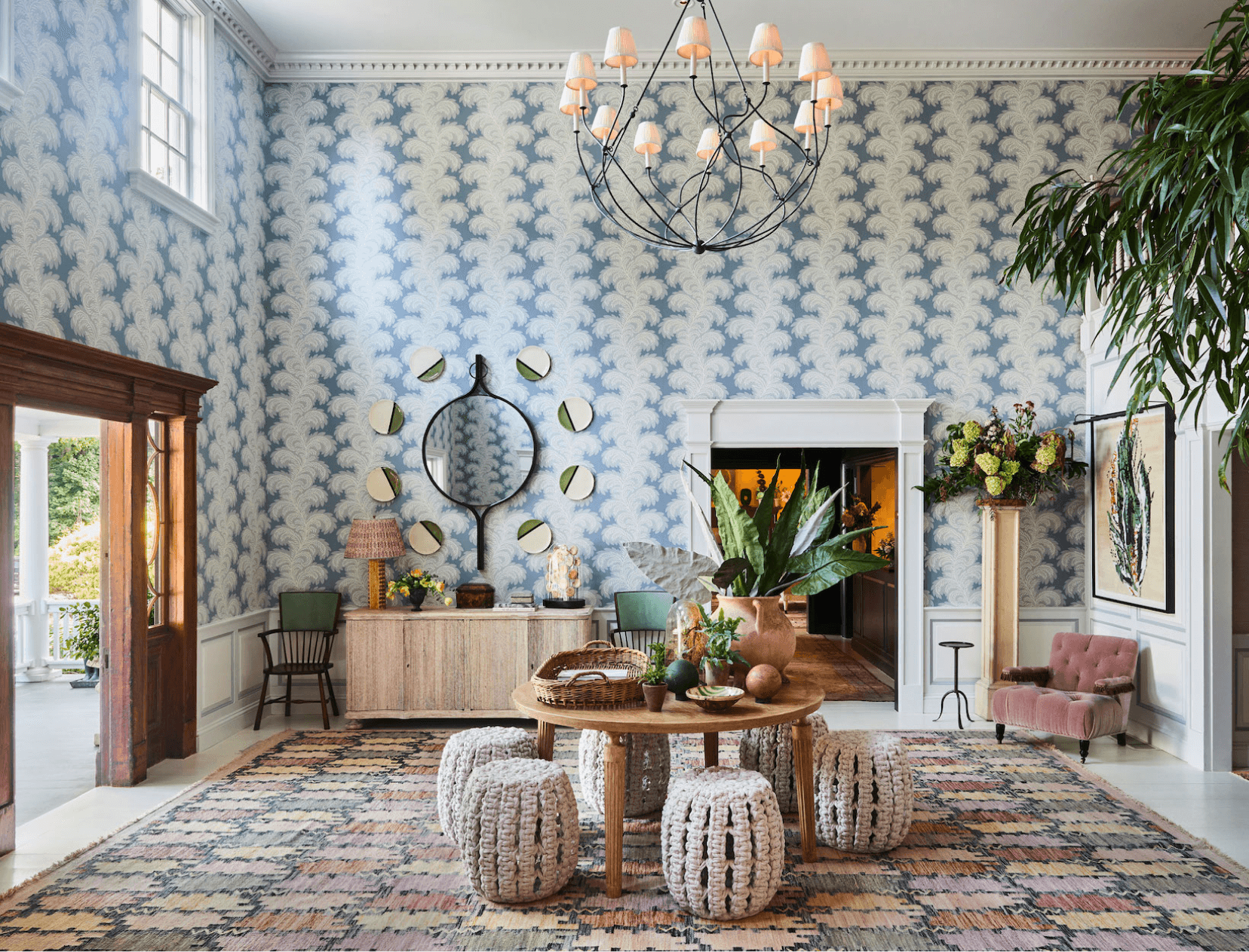 room interior decorated with bluish  wallpaper and respective  tables and chairs