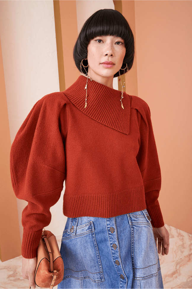 woman posing wearing an ulla Johnson pullover