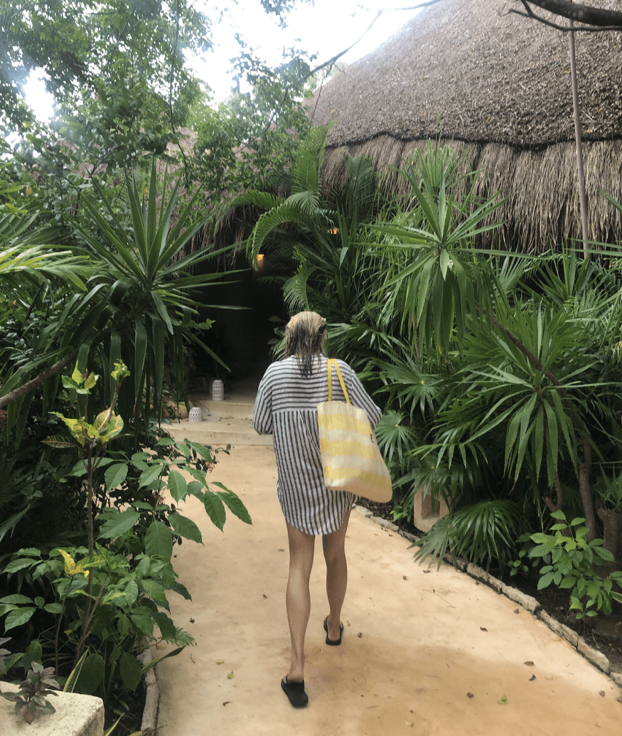 Kiki walking through a garden