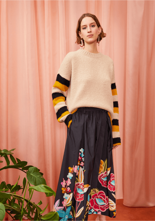 woman posing wearing a la double j sweater