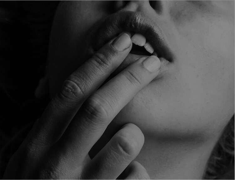 woman touching her lips
