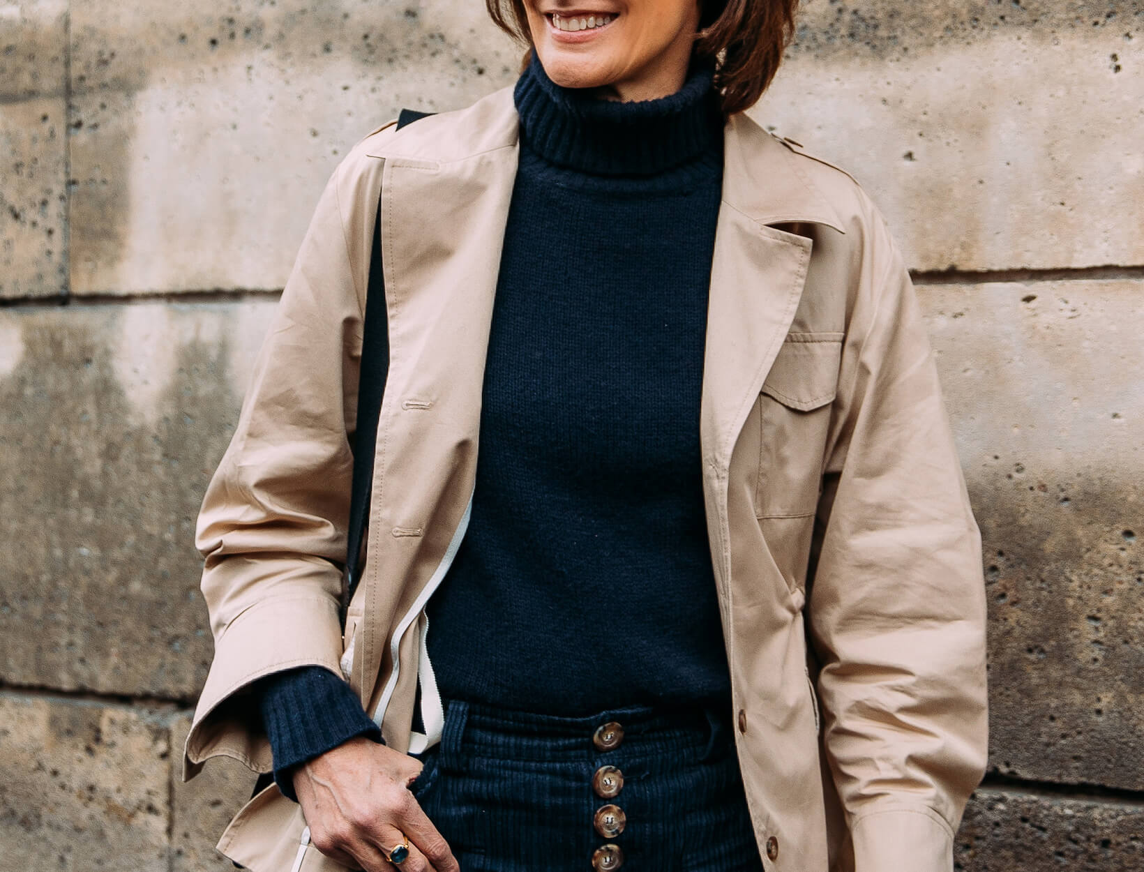 woman wearing a turtleneck and jacket