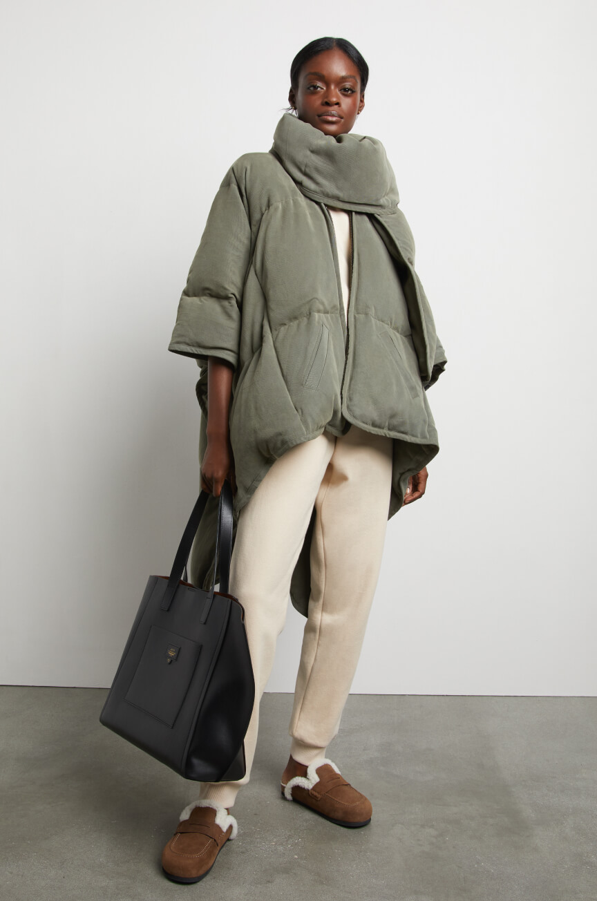 woman posing wearing sia coat