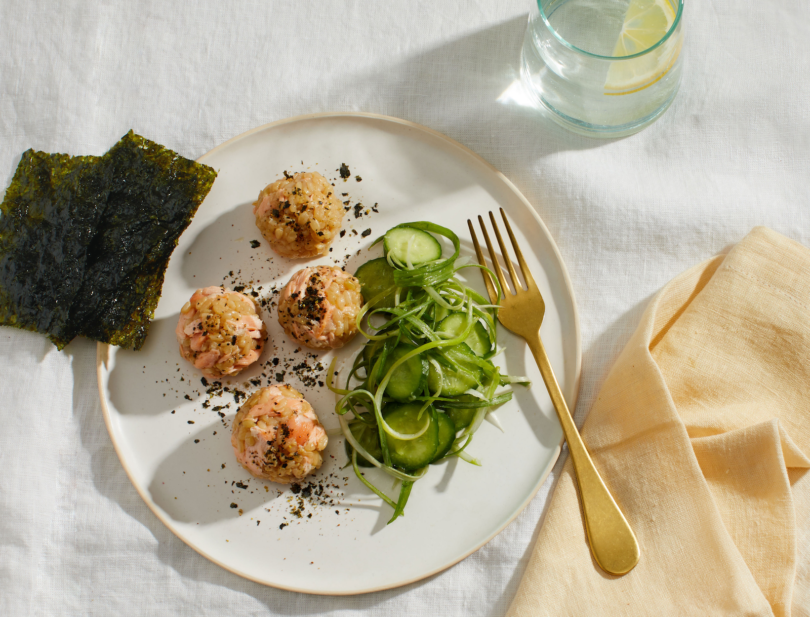 Salmon Rice Balls with Cucumber Salad Recipe goop image