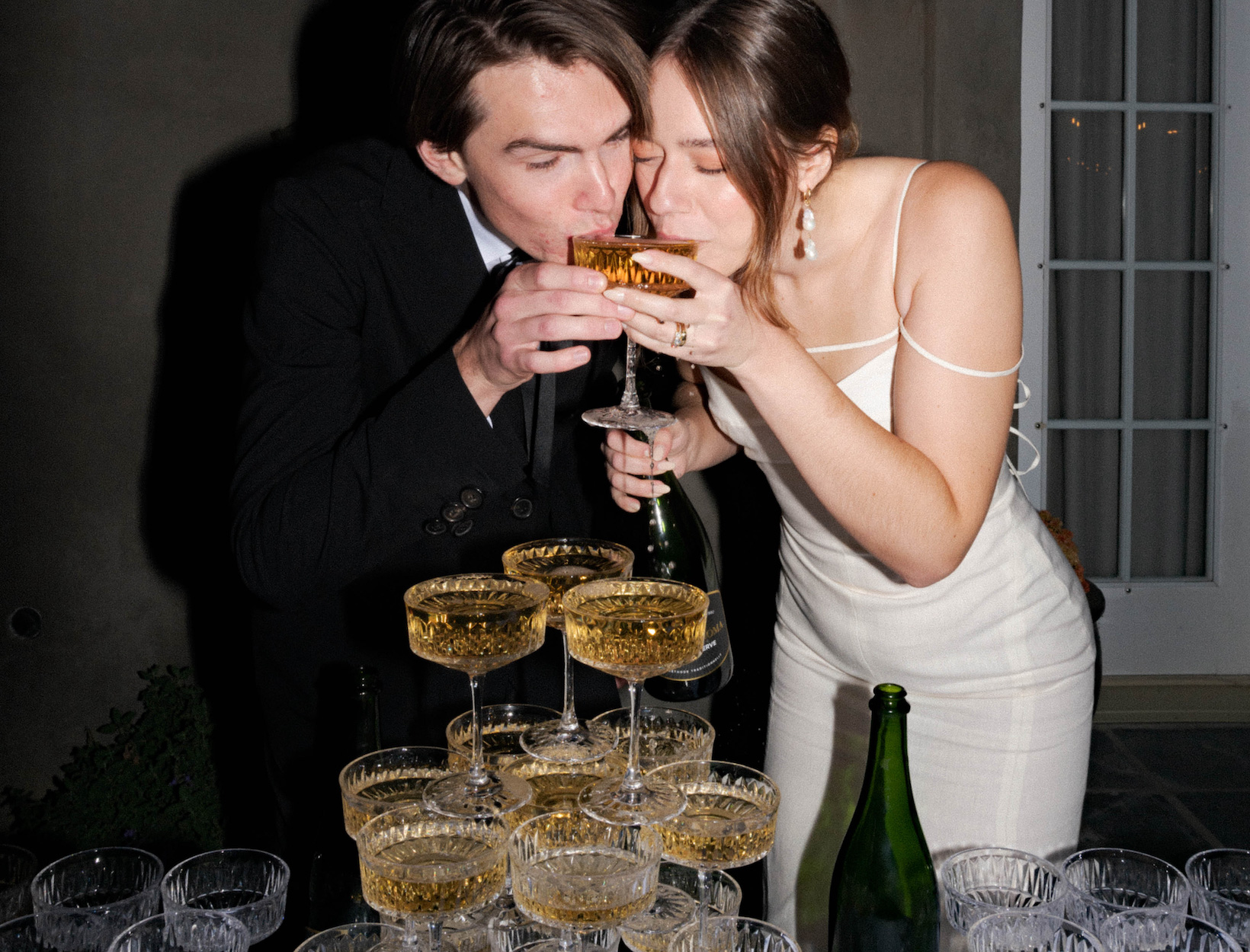 bride and groom having a drink