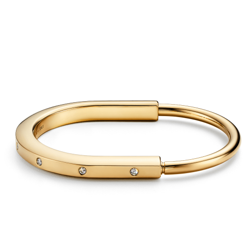 Tiffany & Co. Lock Bangle in Yellow Gold with Diamond Accents Tiffany & Co., $9,500