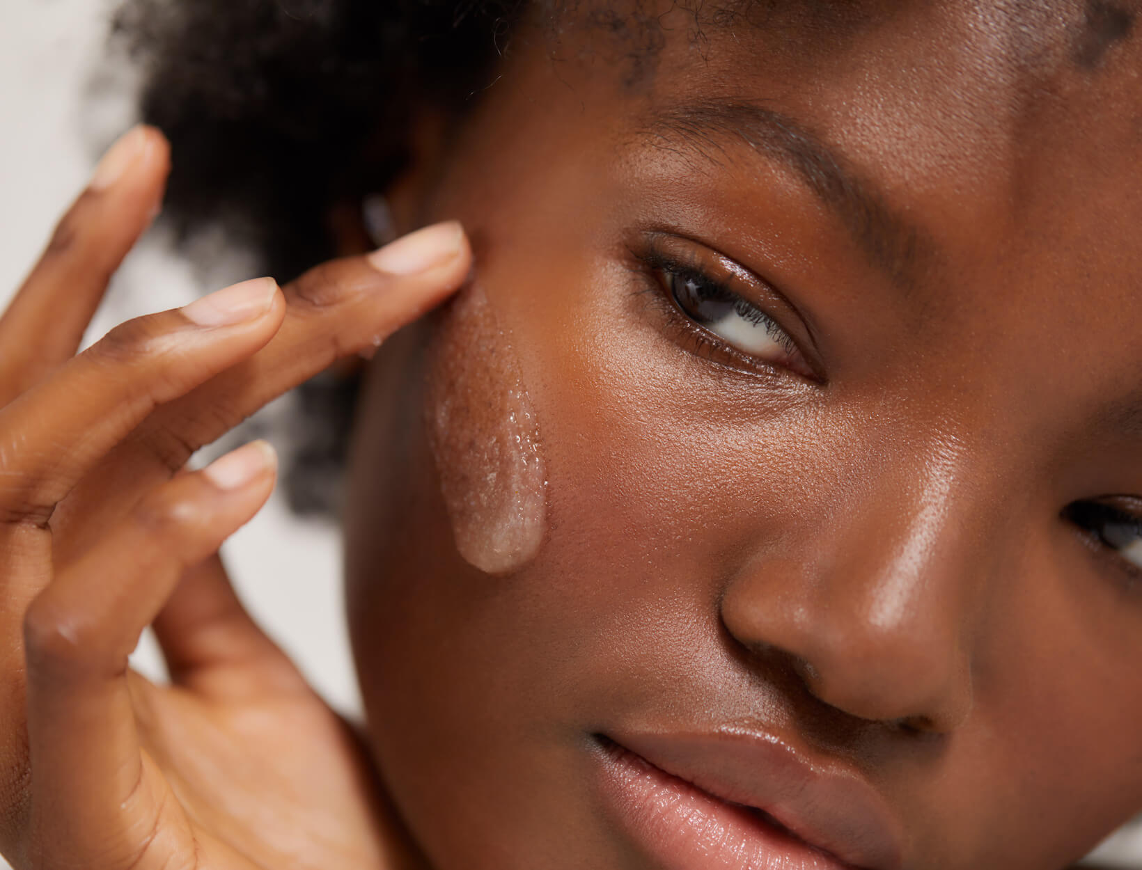 woman using cleanser