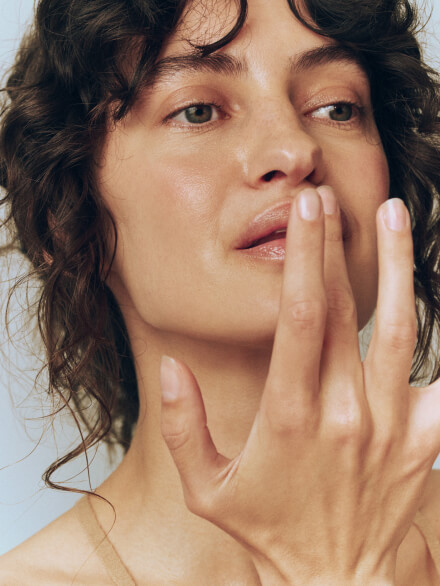 woman using lip balm