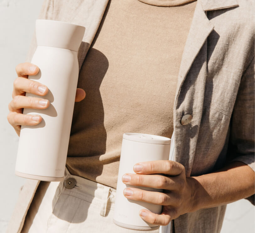 woman holding hitch vessel  and cup